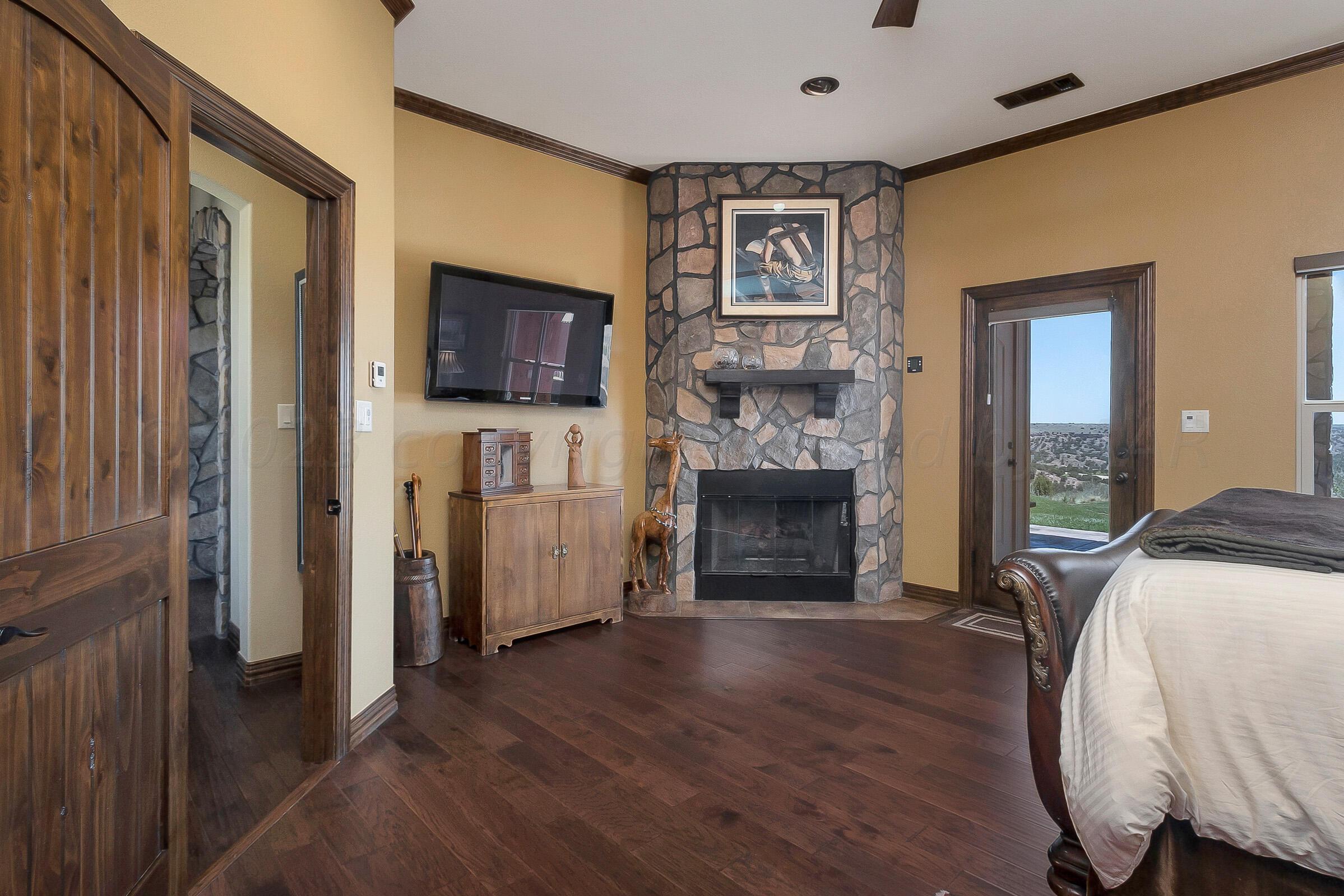7801 East Lake View Road Amarillo, TX 79118 - Photo 31 of 54 Fireplace in Master