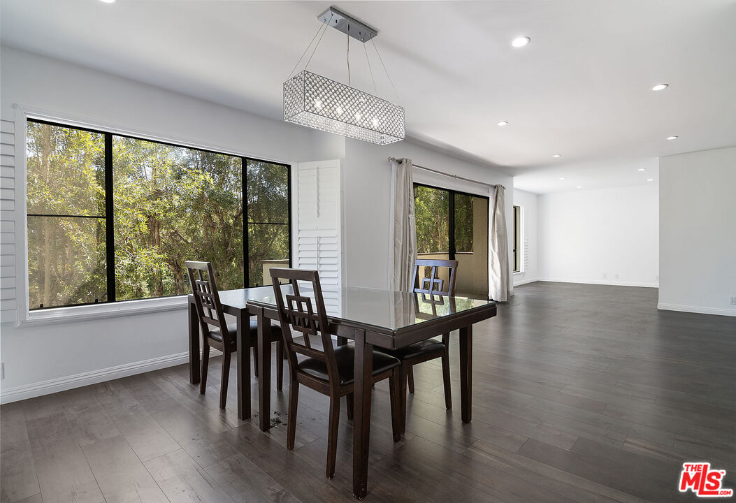853 Le Doux Road, Unit 201 Los Angeles, CA 90035 - Photo 11 of 36 a view of a dining room with furniture window and wooden floor