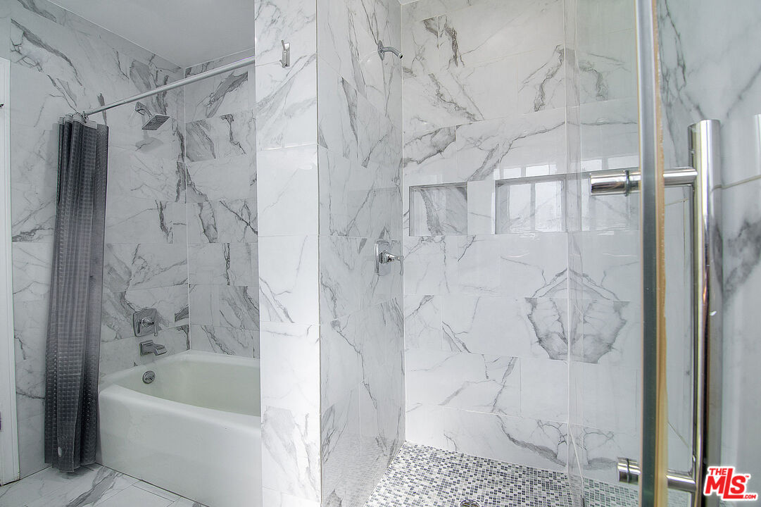 853 Le Doux Road, Unit 201 Los Angeles, CA 90035 - Photo 26 of 36 a bathroom with a bathtub and a shower