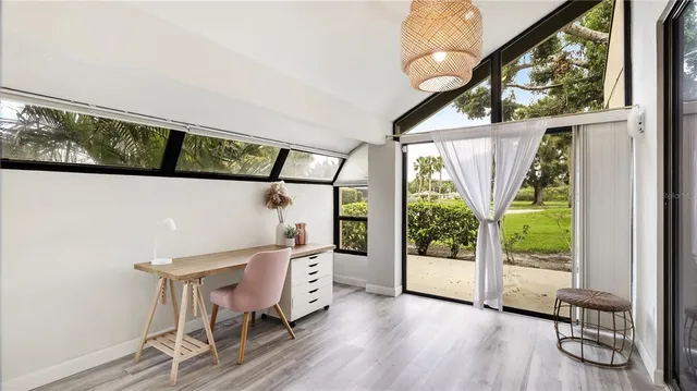 a view of a chairs and table in a balcony