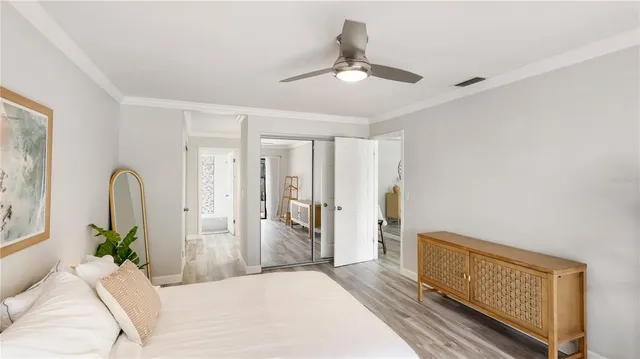 a living room with furniture and chandelier