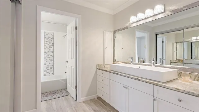 a bathroom with a sink and a mirror