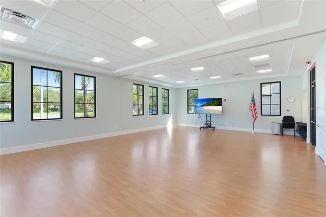 a view of a livingroom with hardwood floor and a flat screen tv