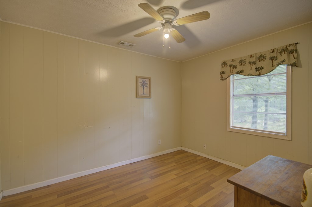 92 No-Where Road Blairsville, GA 30512 - Photo 17 of 36 a view of an empty room with wooden floor and a window