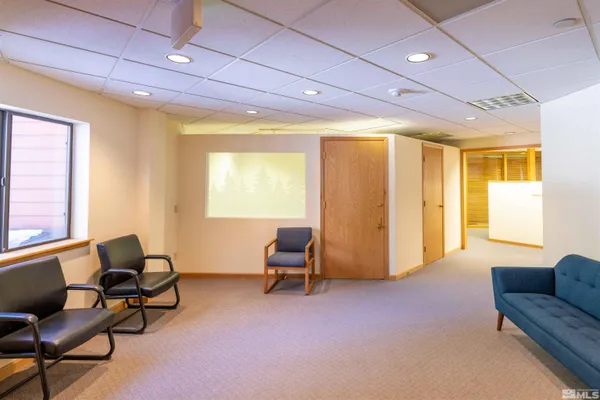 a view of a kitchen with a sink and cabinets