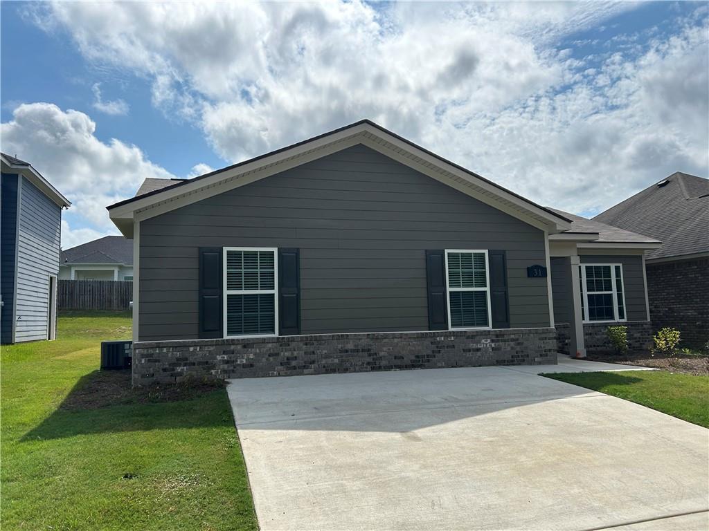 31 Whiterock Road Phenix City, AL 36869 - Photo 16 of 36 View of front of property featuring a front lawn and stone siding