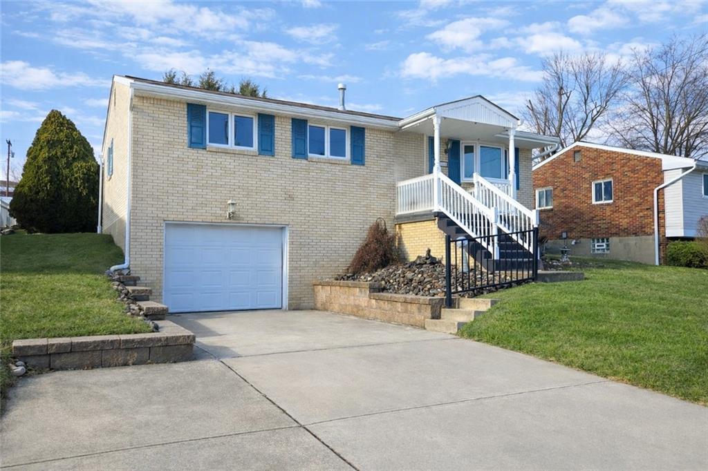 262 Vista Drive Apollo, PA 15613 - Photo 2 of 23 a front view of a house with garden