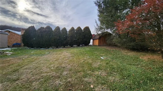 a view of a pool with a yard