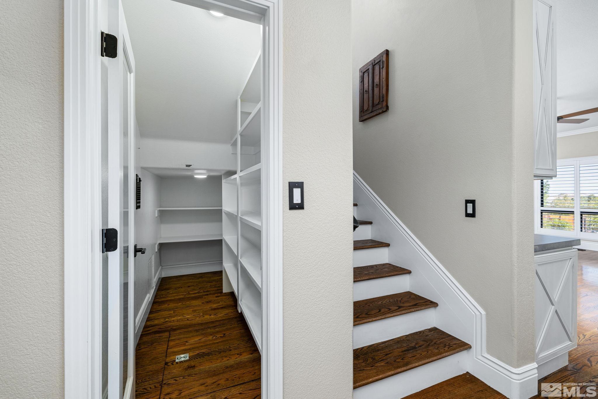 12595 Water Lily Way Reno, NV 89511 - Photo 13 of 36 a view of a hallway with wooden floor and entryway