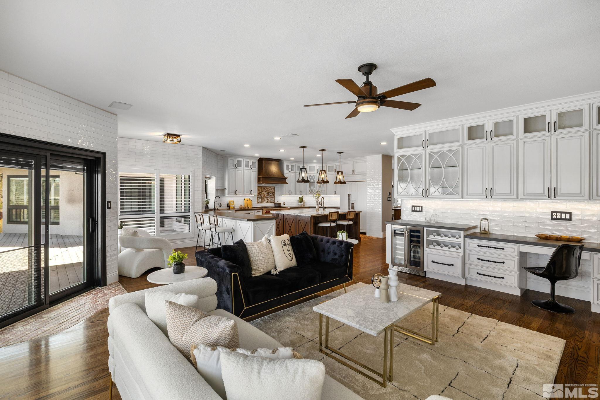 12595 Water Lily Way Reno, NV 89511 - Photo 14 of 36 a living room with stainless steel appliances kitchen island granite countertop furniture and a view of kitchen