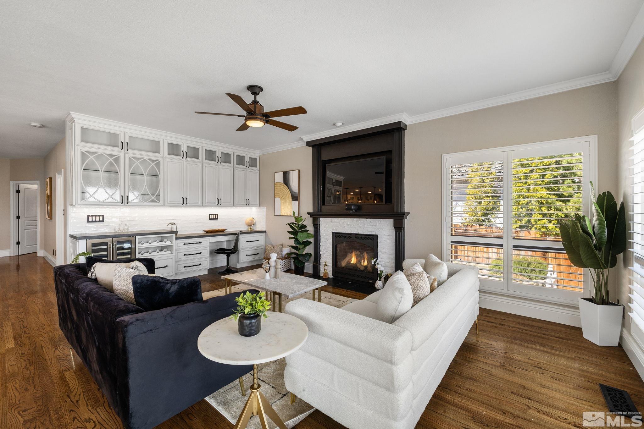 12595 Water Lily Way Reno, NV 89511 - Photo 15 of 36 a living room with furniture and a fireplace