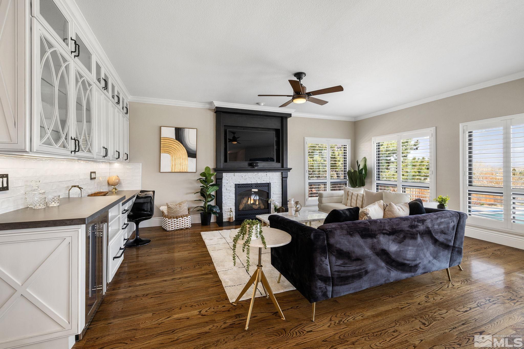12595 Water Lily Way Reno, NV 89511 - Photo 16 of 36 a living room with fireplace furniture and a flat screen tv