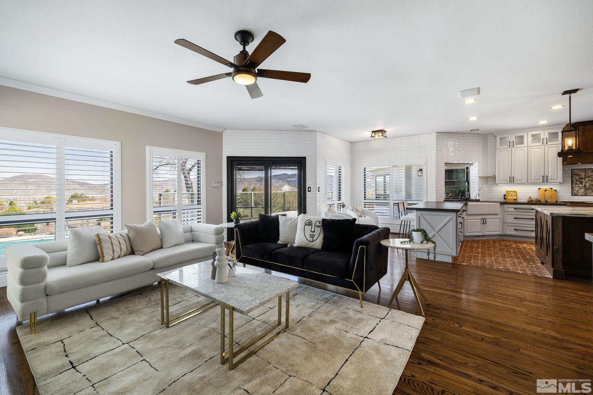 12595 Water Lily Way Reno, NV 89511 - Photo 17 of 36 a living room with furniture kitchen view and a large window