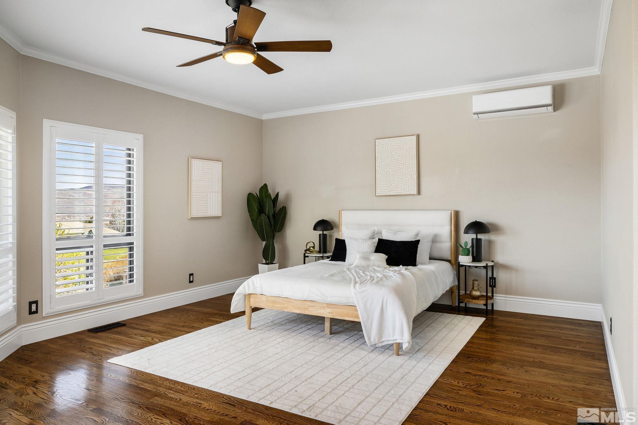 12595 Water Lily Way Reno, NV 89511 - Photo 18 of 36 a bedroom with a bed wooden floor and window
