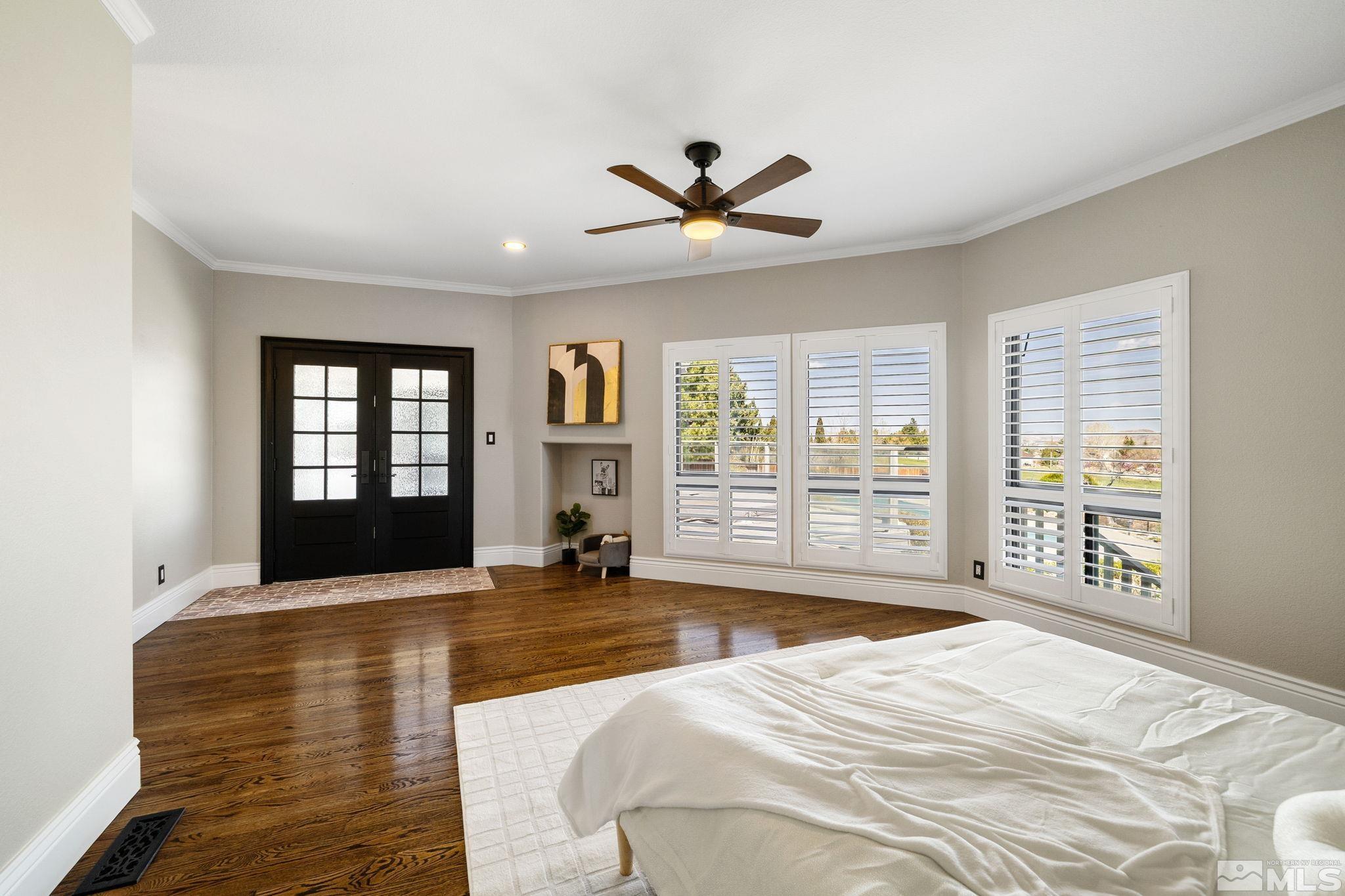 12595 Water Lily Way Reno, NV 89511 - Photo 19 of 36 a bedroom with a bed and a large window