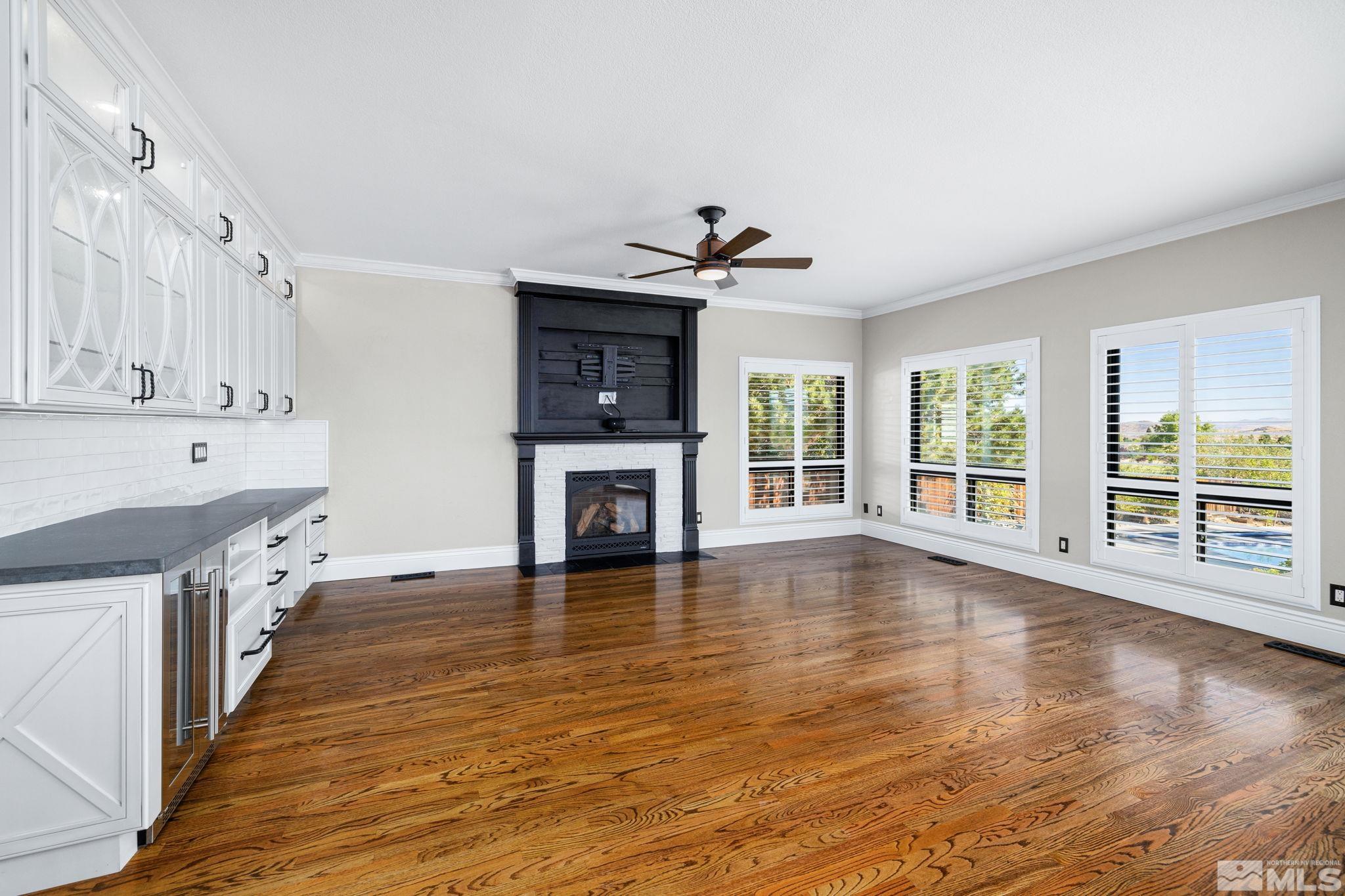 12595 Water Lily Way Reno, NV 89511 - Photo 26 of 36 a view of an empty room with wooden floor and a window