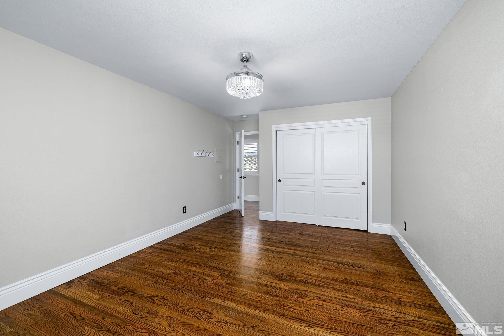 12595 Water Lily Way Reno, NV 89511 - Photo 29 of 36 wooden floor in an empty room