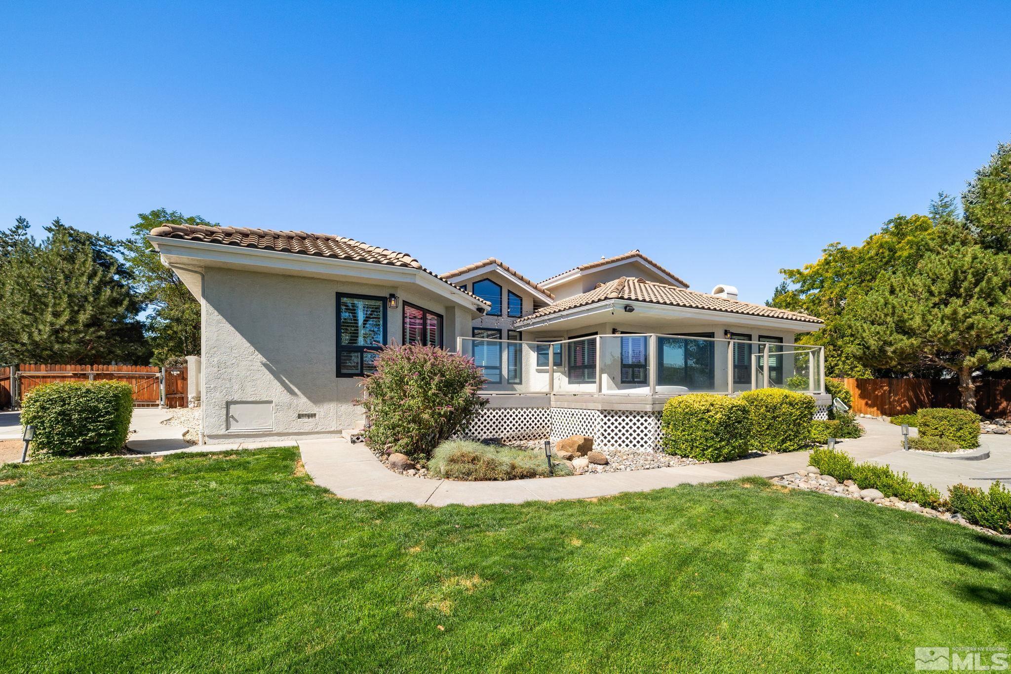 12595 Water Lily Way Reno, NV 89511 - Photo 32 of 36 a front view of a house with a yard