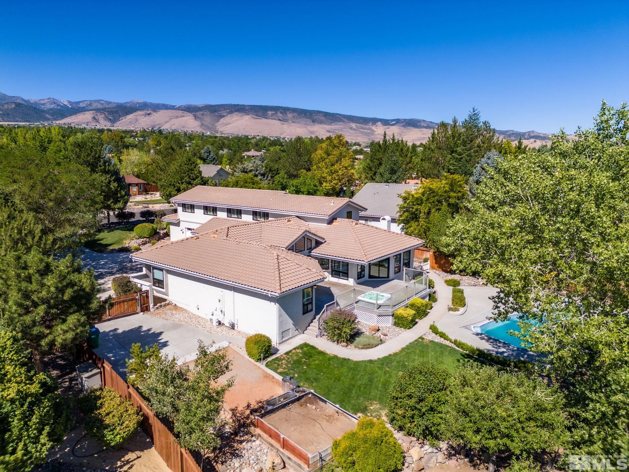 12595 Water Lily Way Reno, NV 89511 - Photo 33 of 36 an aerial view of residential houses with outdoor space and trees