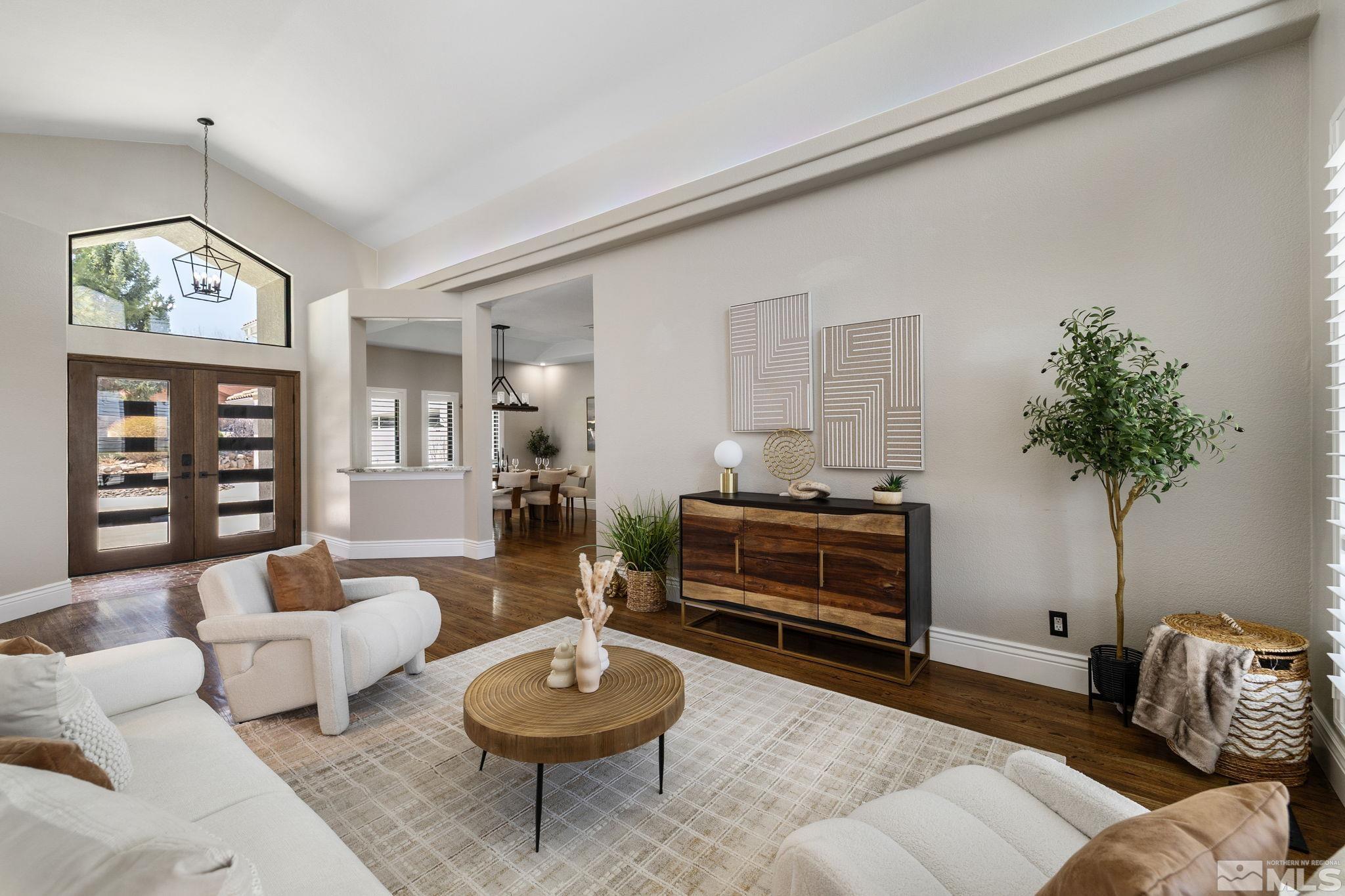 12595 Water Lily Way Reno, NV 89511 - Photo 4 of 36 a living room with furniture and a potted plant