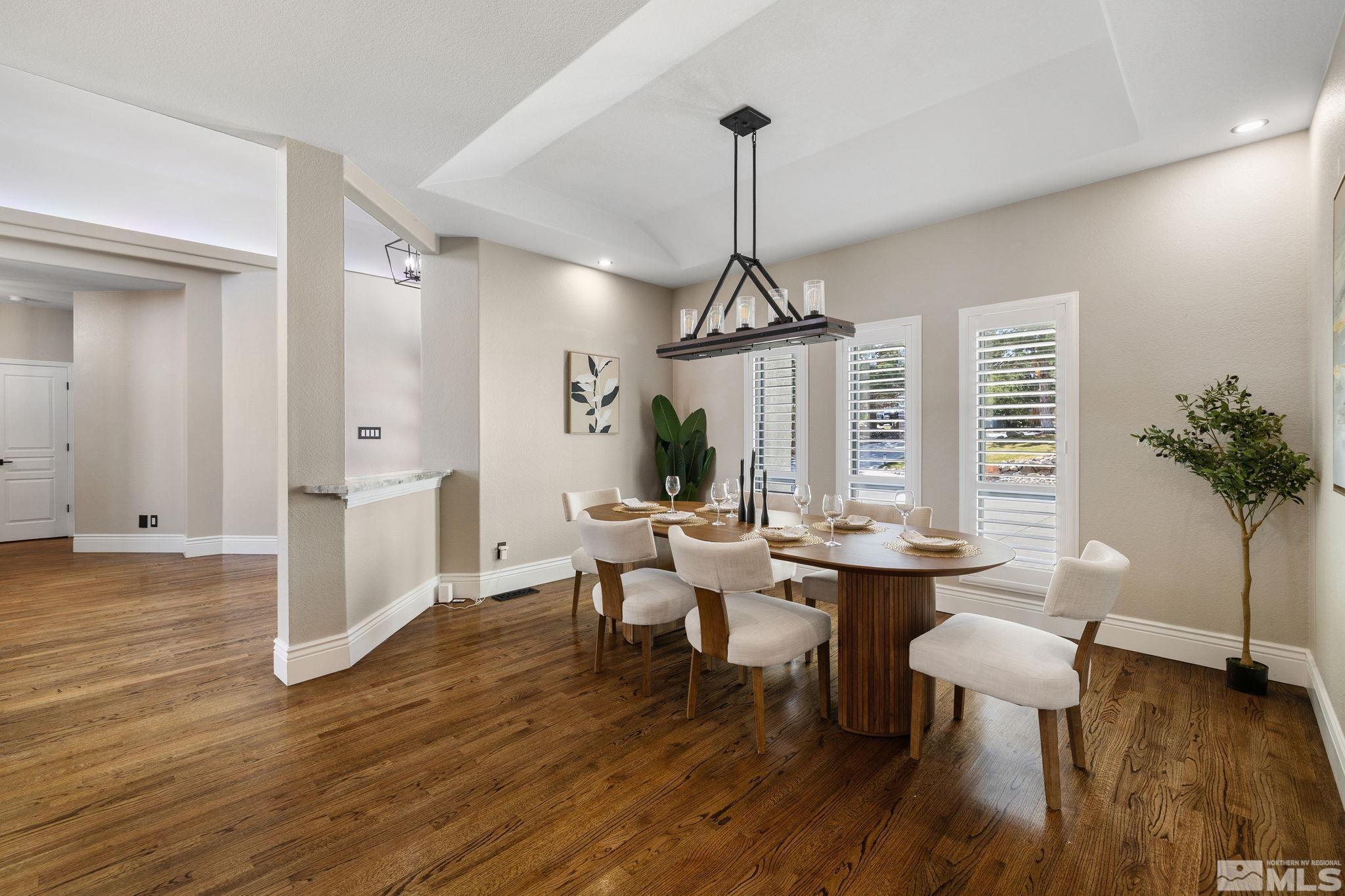 12595 Water Lily Way Reno, NV 89511 - Photo 7 of 36 a view of a livingroom with furniture window and wooden floor
