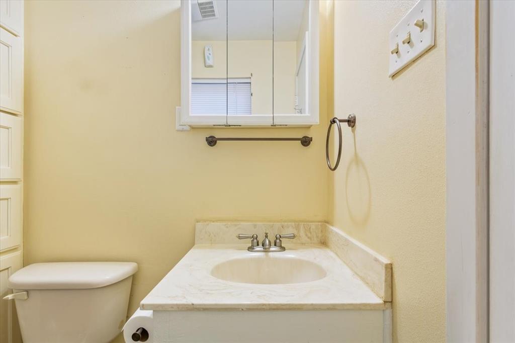 6209 May Drive Waco, TX 76710 - Photo 18 of 30 Bathroom with vanity and toilet