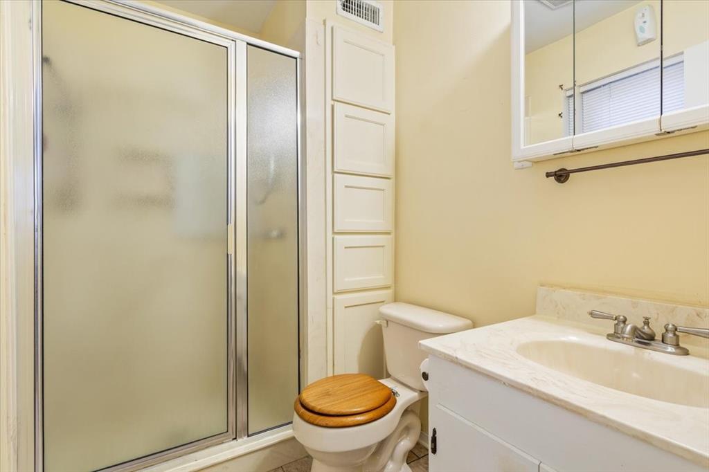 6209 May Drive Waco, TX 76710 - Photo 19 of 30 Bathroom featuring vanity, a stall shower, and light tile patterned floors