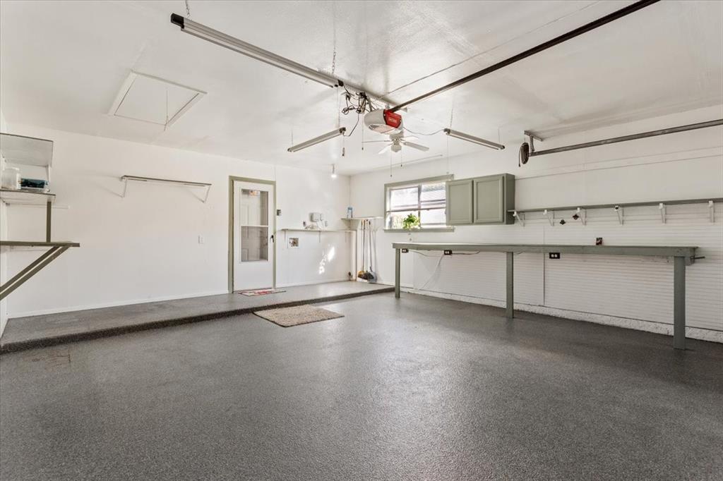 6209 May Drive Waco, TX 76710 - Photo 23 of 30 Garage with a ceiling fan and a garage door opener