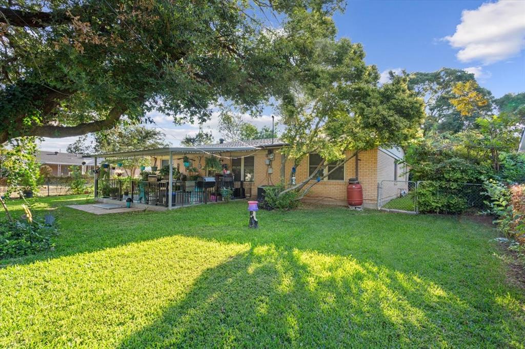 6209 May Drive Waco, TX 76710 - Photo 27 of 30 Rear view of property featuring brick siding, a patio, and a gate