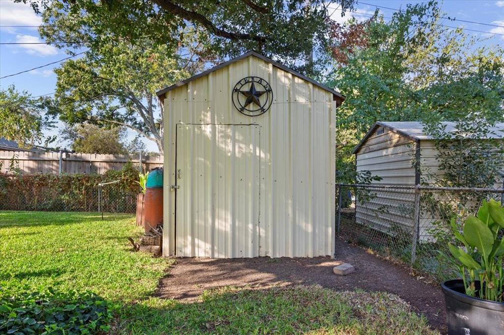 6209 May Drive Waco, TX 76710 - Photo 29 of 30 View of shed with a fenced backyard
