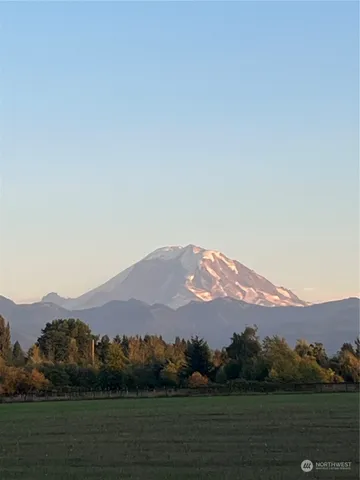 a view of a town with mountains in the background