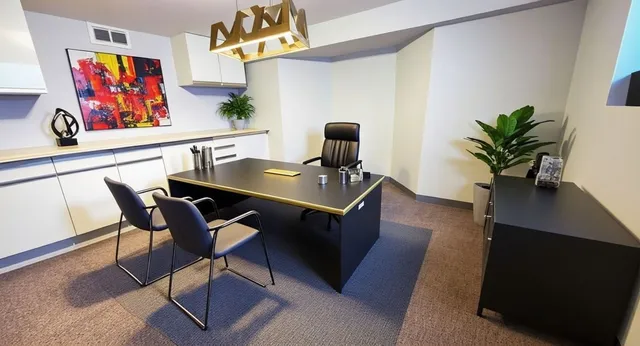 a view of a workspace with furniture