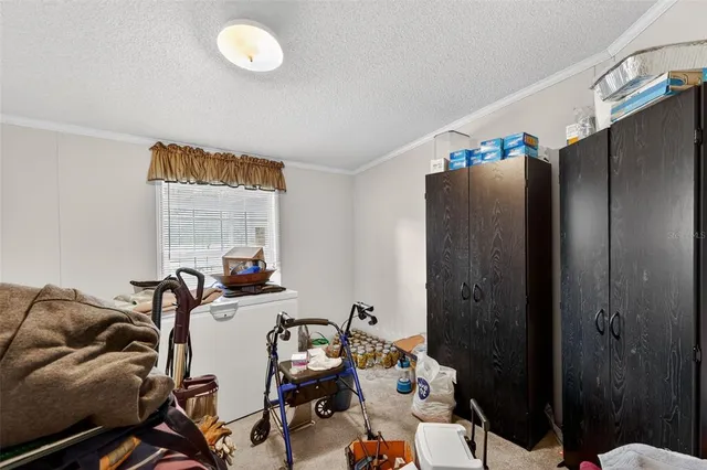 a bedroom with furniture and a gate