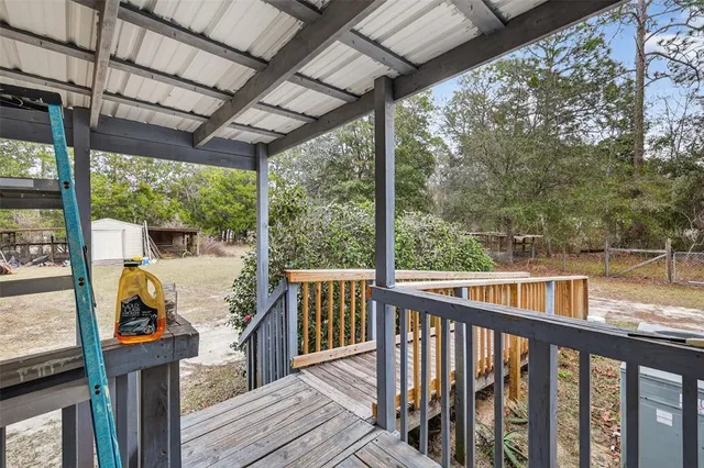a view of a two chair and table in the balcony