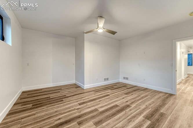 1282 South Crystal Road Lake George, CO 80827 - Photo 14 of 26 Spare room featuring ceiling fan and light wood-style floors