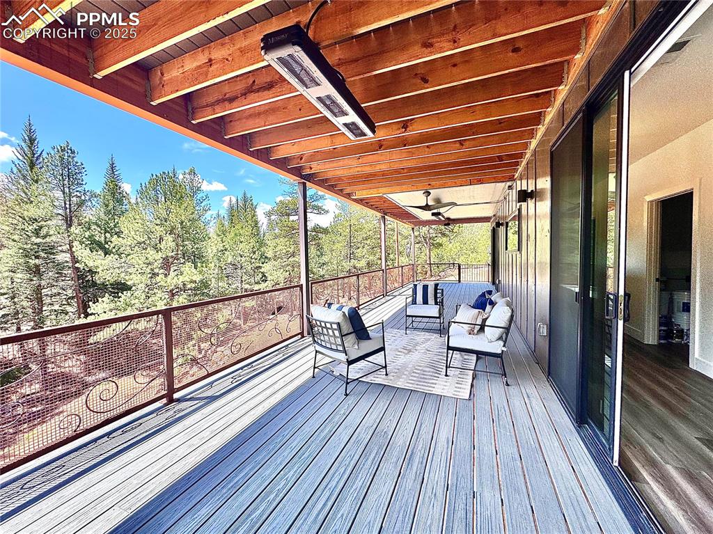 1282 South Crystal Road Lake George, CO 80827 - Photo 4 of 26 Upper level deck with an outdoor living space and heater