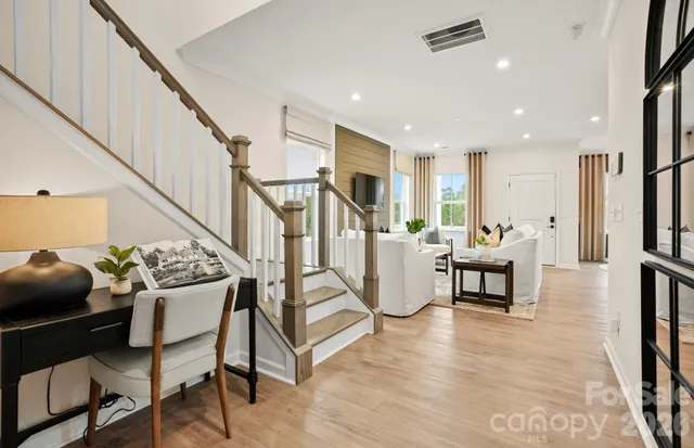 a dining room with furniture and entryway