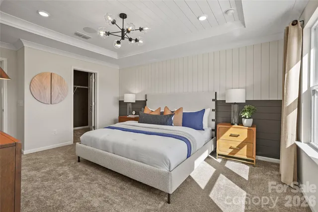 a spacious bedroom with a bed and window