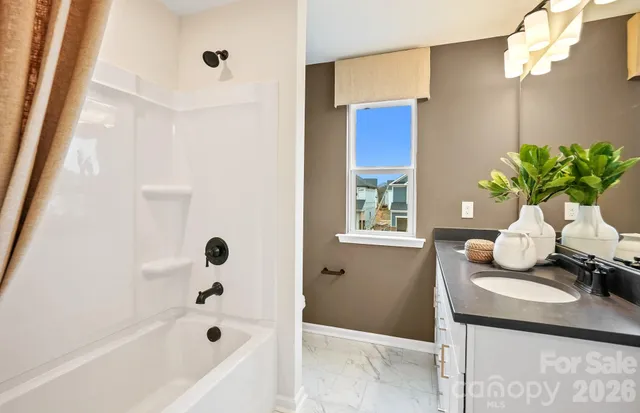 a bath room with a sink and a bath tub