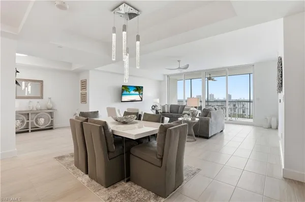 a view of kitchen with dining area windows and chairs