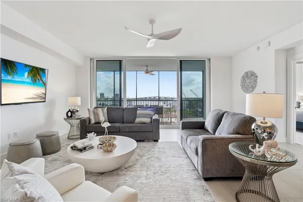 a living room with furniture and a large window