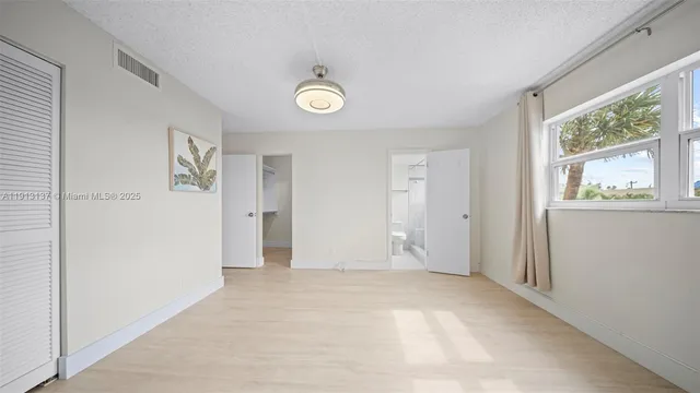 a view of a hallway with stairs