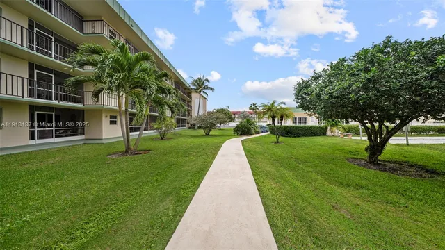 a view of a living room and kitchen
