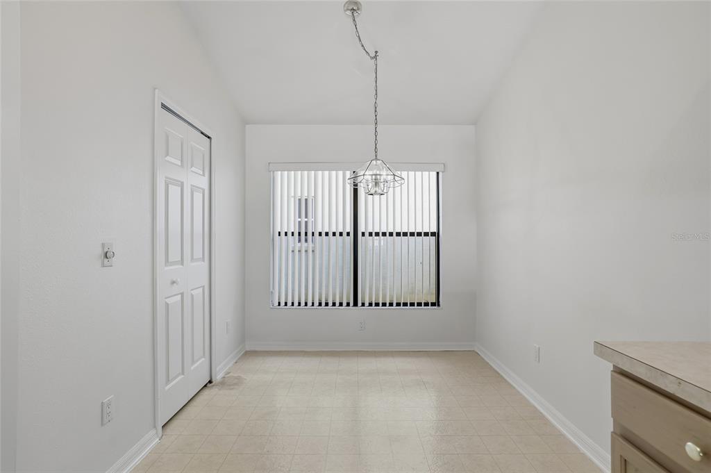 6935 Freeport Road Riverview, FL 33578 - Photo 14 of 51 a view of a room with wooden floor and windows
