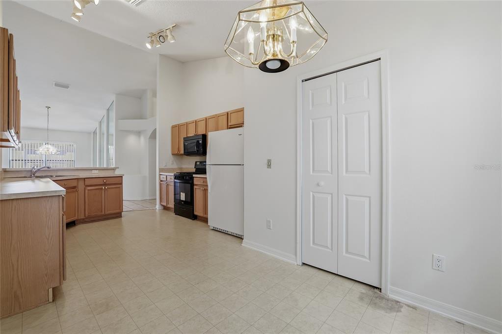 6935 Freeport Road Riverview, FL 33578 - Photo 15 of 51 a view of a kitchen with stainless steel appliances wooden floor and more cabinets