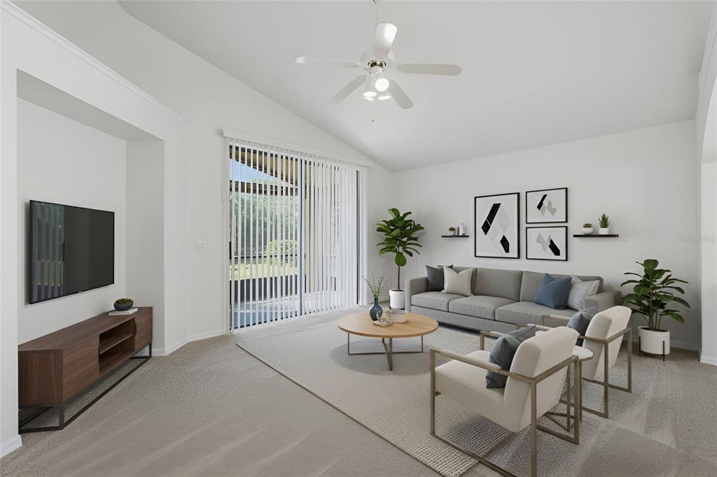 6935 Freeport Road Riverview, FL 33578 - Photo 19 of 51 a living room with furniture a flat screen tv and a window
