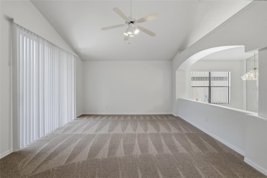 6935 Freeport Road Riverview, FL 33578 - Photo 20 of 51 wooden floor in an empty room with a window