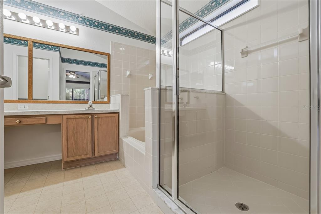 6935 Freeport Road Riverview, FL 33578 - Photo 27 of 51 a bathroom with a sink a mirror and a shower