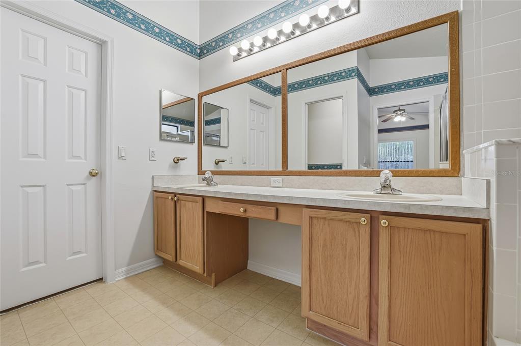 6935 Freeport Road Riverview, FL 33578 - Photo 28 of 51 a bathroom with a sink and a mirror