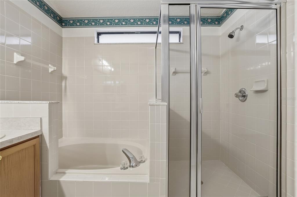 6935 Freeport Road Riverview, FL 33578 - Photo 30 of 51 a bathroom with a bathtub and shower